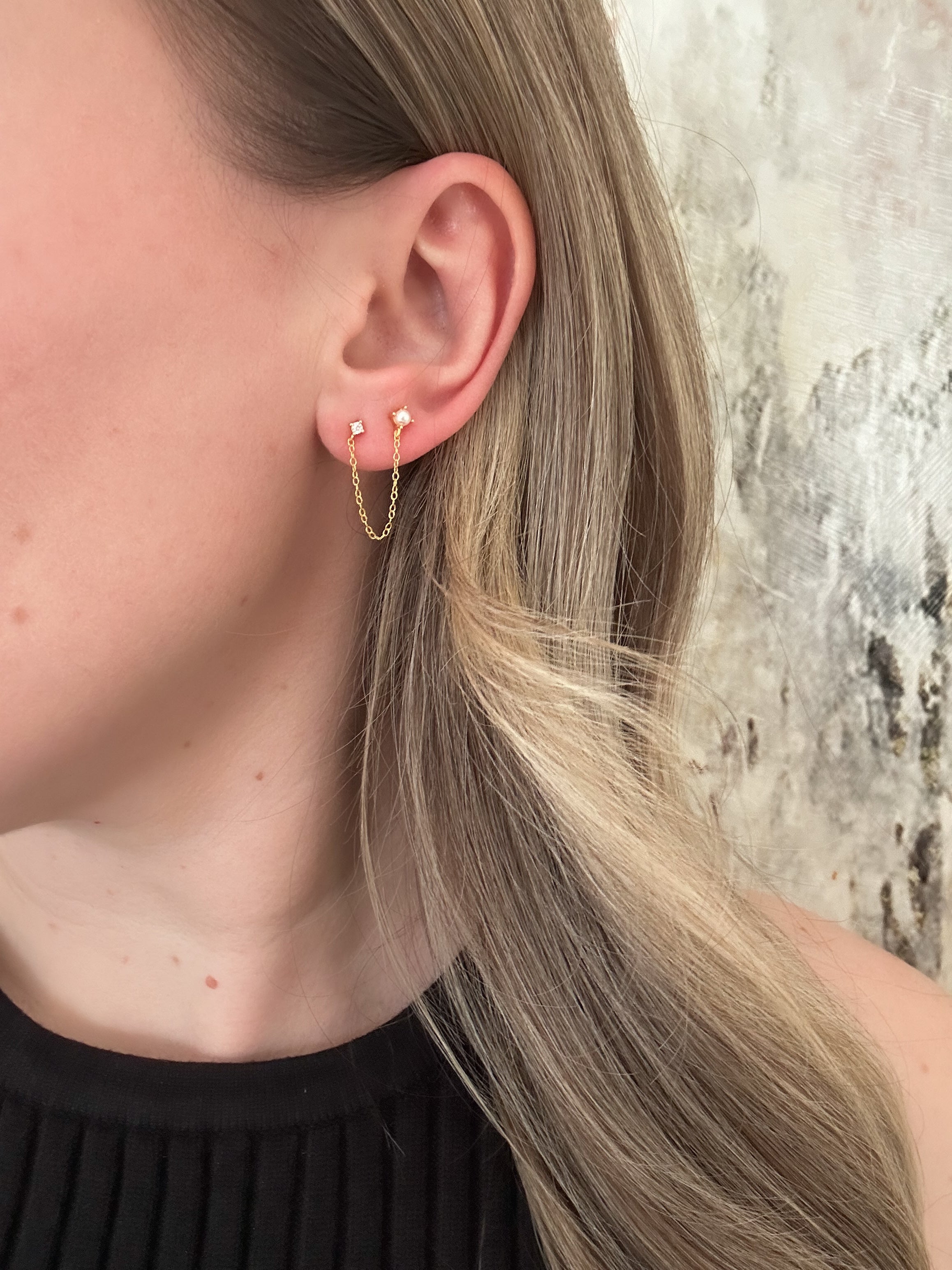 Earrings that connect two on sale piercings